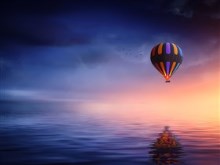 Hot Air Balloon over Calm Sea